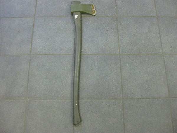 Vintage axe with long handle on a tiled floor, potential slight damage due to age. Vintage axe with long handle on a tiled floor, potential slight damage due to age.