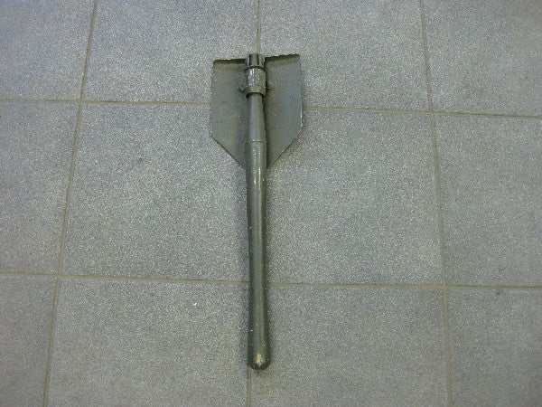 Pioniersschep with vintage wear on tiled floor. Pioniersschep with vintage wear on tiled floor.